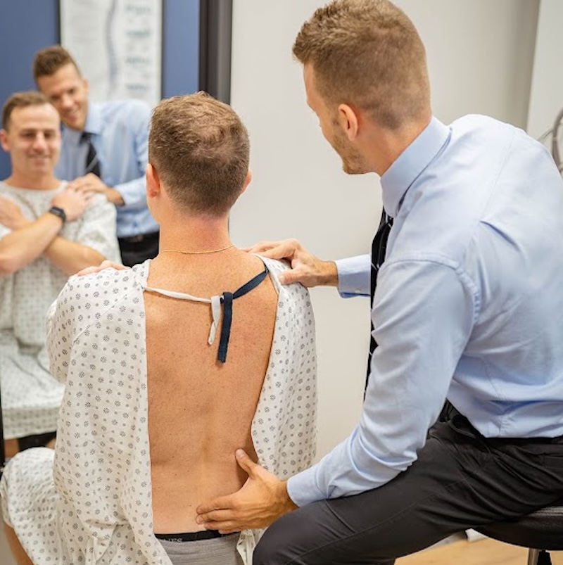 Dr. Nicholas Esser talking to his patient
