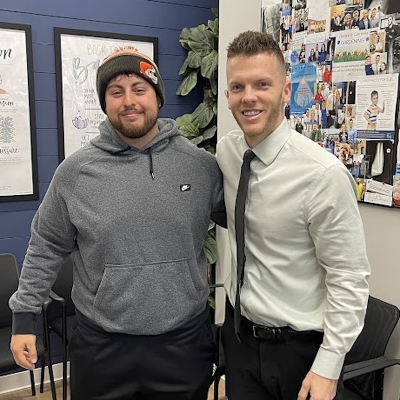 Dr. Nicholas Esser working with Alex D, patient