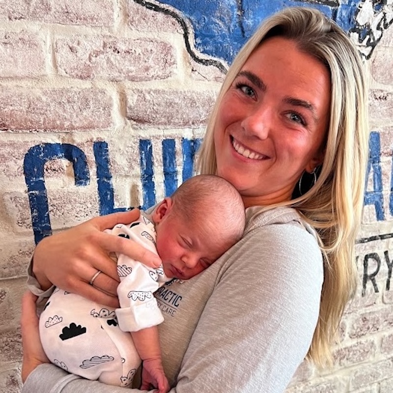 Ayla P. holding a new born, pediatric chiropractor